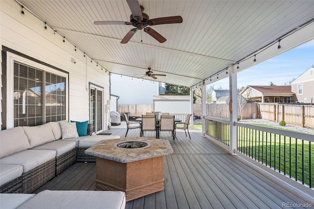 4733 S Vivian Ct, Morrison, CO 80465 - wooden terrace featuring outdoor dining area, an outdoor living space with a fire pit, and ceiling fan