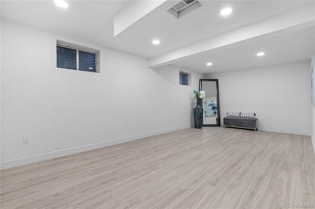 basement featuring light hardwood / wood-style flooring