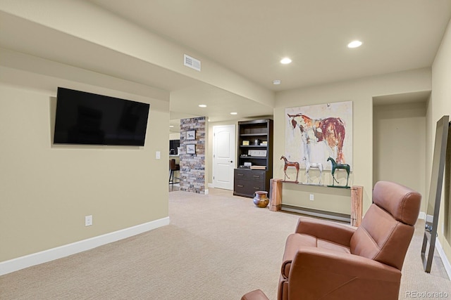 sitting room with carpet flooring