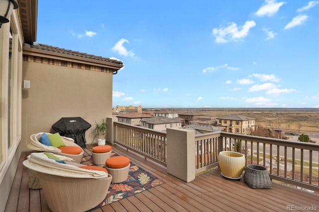 wooden deck with grilling area