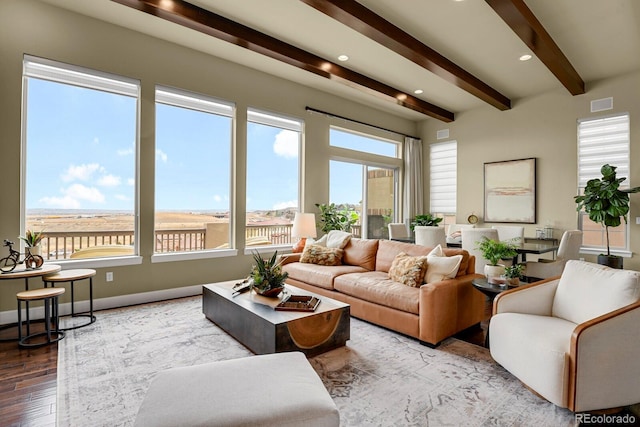 living room with hardwood / wood-style flooring and beamed ceiling