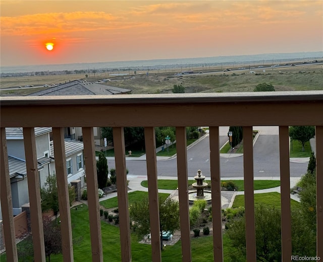 view of balcony at dusk