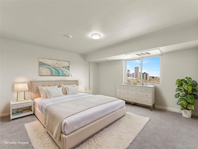 bedroom with carpet floors and baseboards