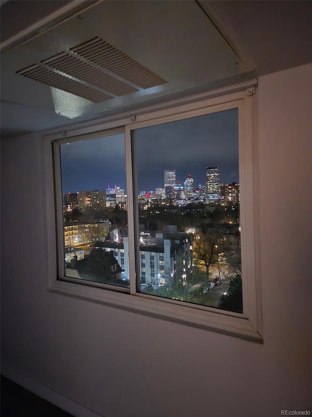 interior details featuring a view of city lights