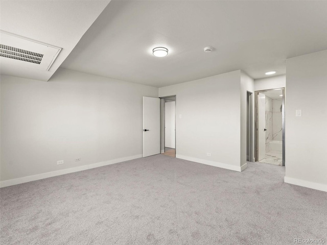 unfurnished bedroom with carpet floors, visible vents, baseboards, recessed lighting, and connected bathroom