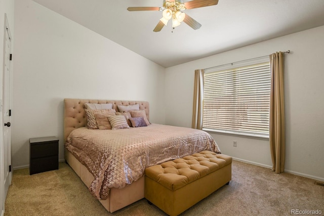 bedroom featuring ceiling fan, light colored carpet, and lofted ceiling