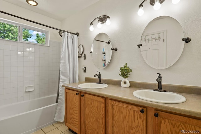 bathroom with tile patterned floors, shower / bath combination with curtain, and vanity