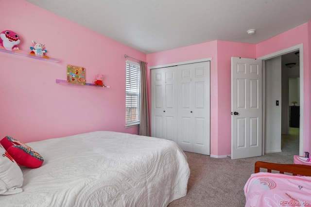 carpeted bedroom with a closet