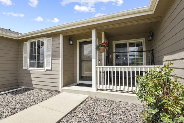 entrance to property featuring a porch