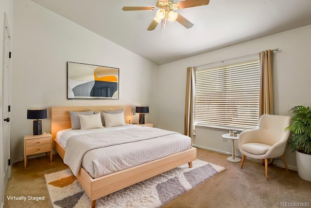 bedroom with lofted ceiling, a ceiling fan, baseboards, and carpet floors