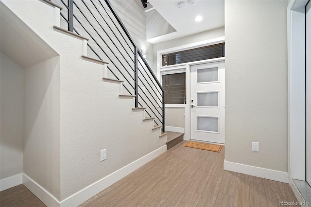 4469 Tennyson St Unit 4, Denver, CO 80212 - entryway with stairway, wood finished floors, and baseboards
