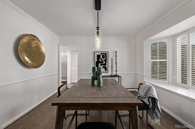 dining area with crown molding and dark hardwood / wood-style flooring