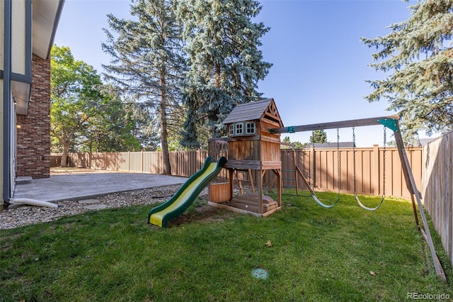 view of jungle gym featuring a patio and a yard