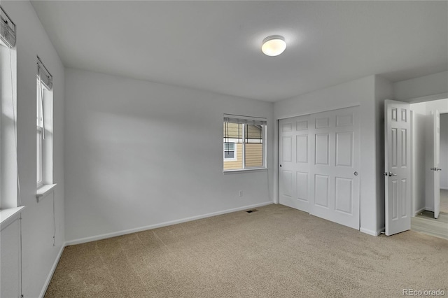 3590 S Malaya St, Aurora, CO 80013 - unfurnished bedroom featuring light colored carpet, baseboards, and a closet