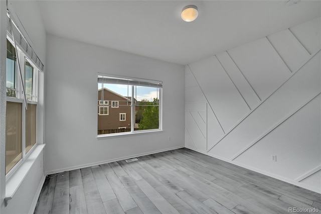 3590 S Malaya St, Aurora, CO 80013 - spare room featuring wood finished floors and baseboards