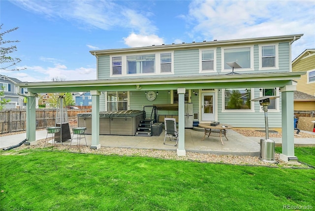 3590 S Malaya St, Aurora, CO 80013 - back of house with a hot tub and a patio