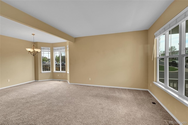 3590 S Malaya St, Aurora, CO 80013 - empty room with a chandelier, carpet floors, and baseboards