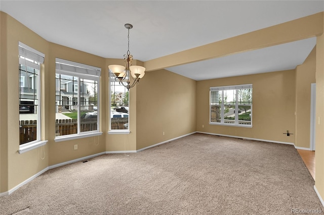 3590 S Malaya St, Aurora, CO 80013 - carpeted spare room featuring a chandelier and baseboards