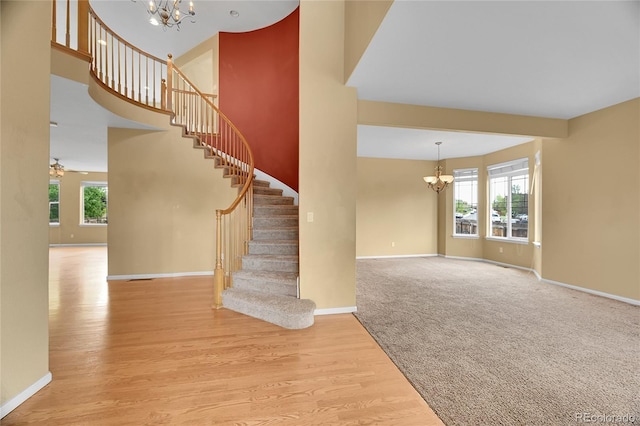 3590 S Malaya St, Aurora, CO 80013 - stairs featuring a chandelier, baseboards, and a towering ceiling
