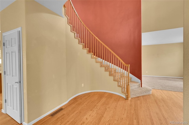 3590 S Malaya St, Aurora, CO 80013 - staircase featuring wood finished floors and baseboards