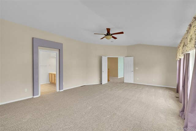 3590 S Malaya St, Aurora, CO 80013 - unfurnished bedroom with light carpet, baseboards, lofted ceiling, ceiling fan, and ensuite bath