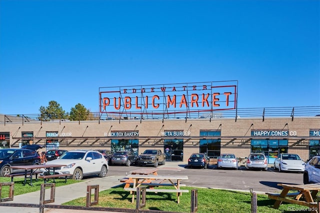 view of commercial location with uncovered parking