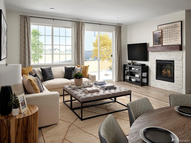 24005 E Utah Pl, Aurora, CO 80018 - living room with light wood-style floors, a fireplace, and recessed lighting