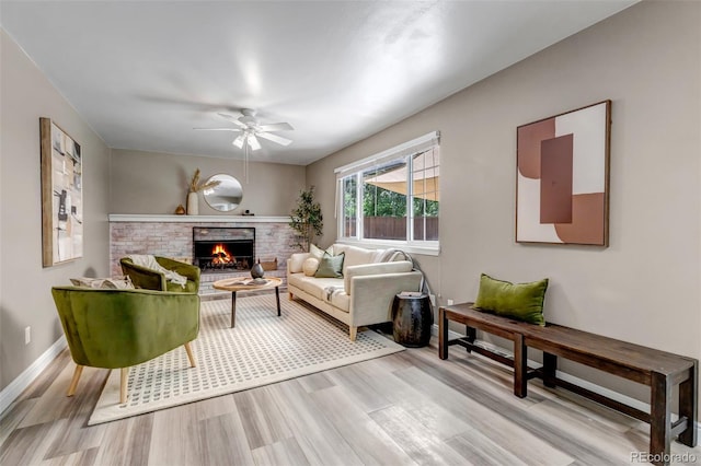 8696 E Easter Ave, Centennial, CO 80112 - living area with a ceiling fan, wood finished floors, and a fireplace