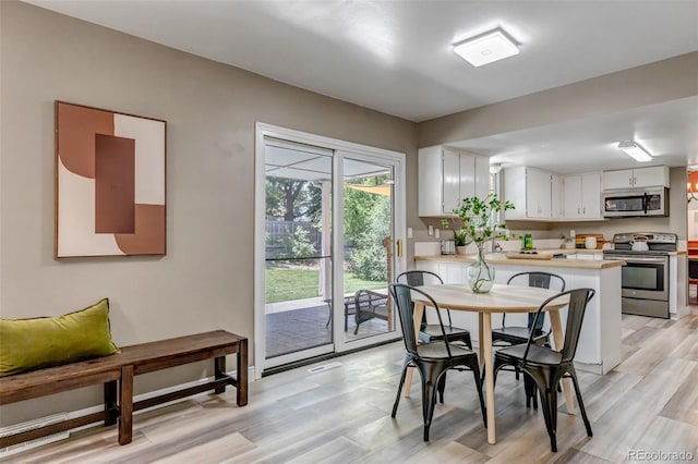 8696 E Easter Ave, Centennial, CO 80112 - dining area with light wood-style floors