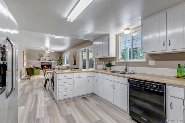 8696 E Easter Ave, Centennial, CO 80112 - kitchen with dishwasher, open floor plan, stainless steel fridge with ice dispenser, and plenty of natural light