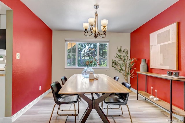 8696 E Easter Ave, Centennial, CO 80112 - dining space featuring light wood-type flooring and a chandelier