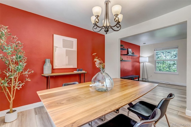 8696 E Easter Ave, Centennial, CO 80112 - dining area with a chandelier and wood finished floors