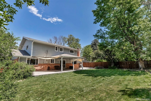 8696 E Easter Ave, Centennial, CO 80112 - rear view of house featuring a patio, a chimney, and brick siding