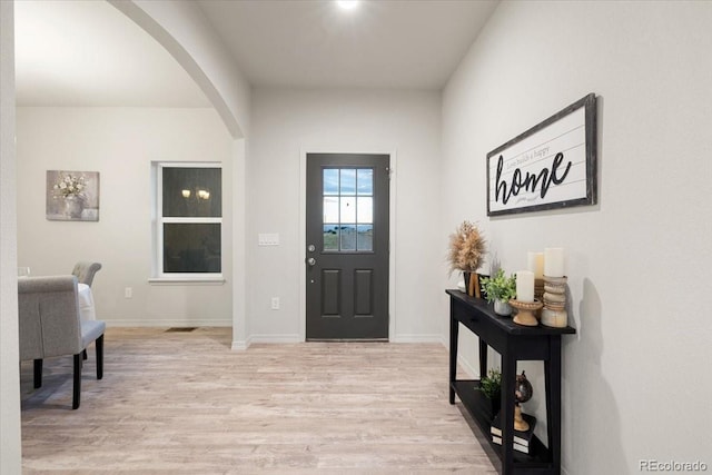 entryway with light hardwood / wood-style floors