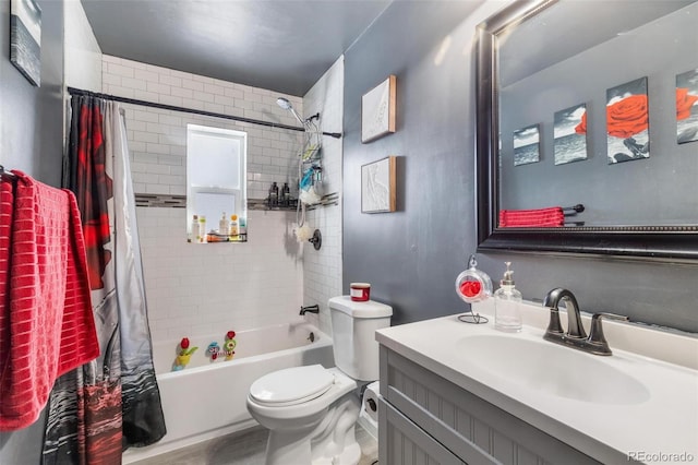 full bathroom featuring vanity, shower / bath combination with curtain, and toilet