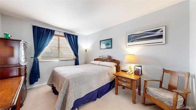 bedroom featuring light carpet