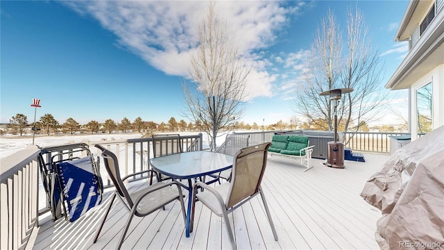 view of snow covered deck