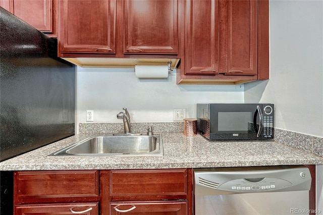 kitchen featuring a sink, dishwasher, black microwave, and light countertops