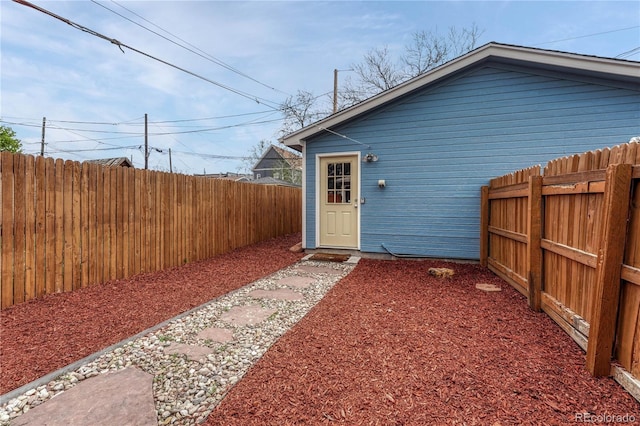 view of outbuilding featuring a fenced backyard