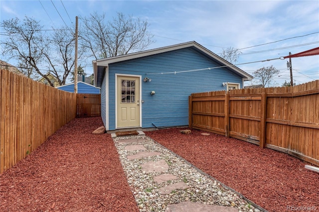 view of outbuilding with a fenced backyard