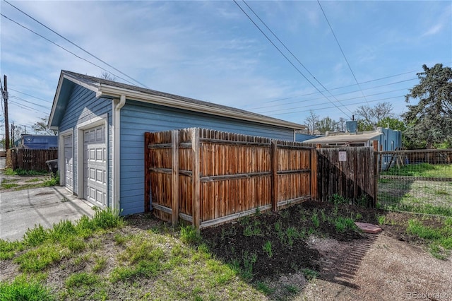 view of outdoor structure featuring fence