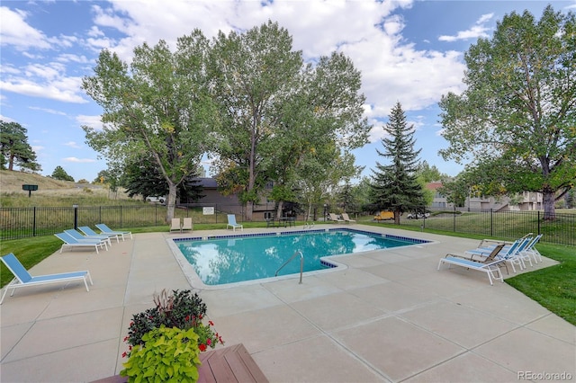 view of swimming pool featuring a patio