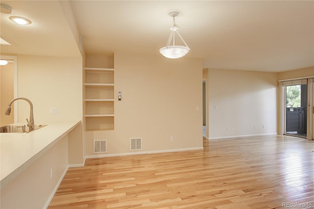 interior space featuring light hardwood / wood-style floors and sink