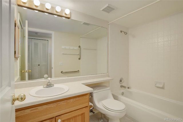 full bathroom featuring vanity, tile patterned flooring, shower / washtub combination, and toilet