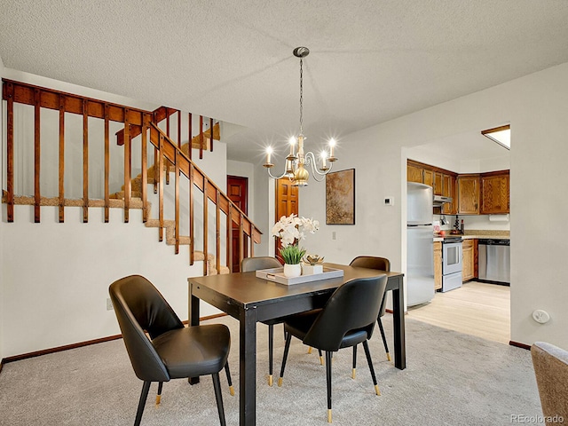 7781 S Curtice Dr Unit D, Littleton, CO 80120 - dining area with light carpet, a chandelier, and stairs
