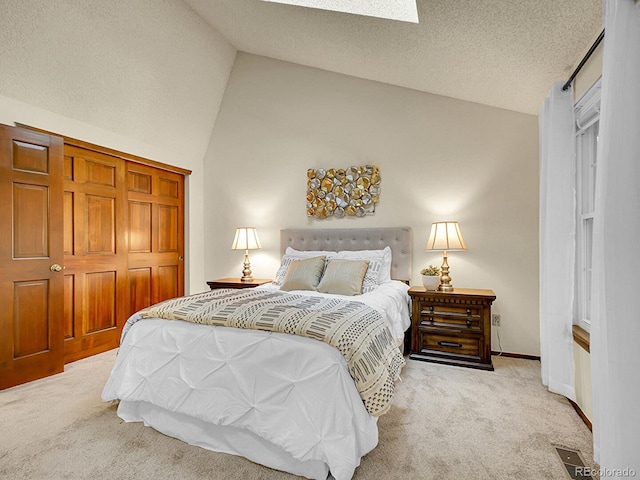 7781 S Curtice Dr Unit D, Littleton, CO 80120 - bedroom featuring vaulted ceiling and carpet floors