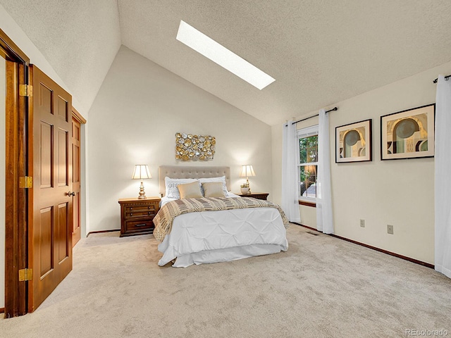 7781 S Curtice Dr Unit D, Littleton, CO 80120 - bedroom featuring a skylight, lofted ceiling, carpet, and a textured ceiling