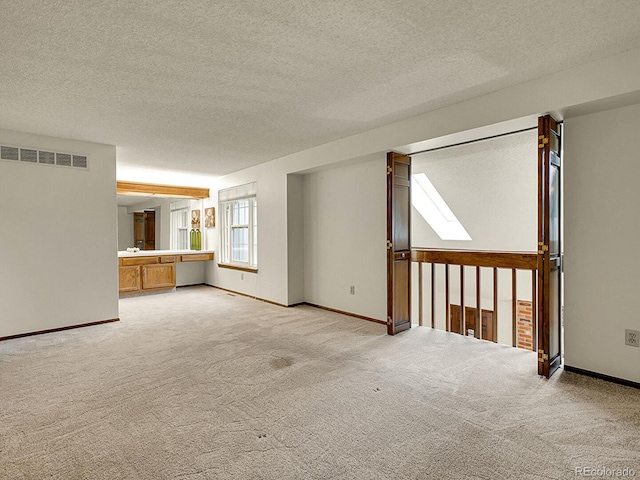 7781 S Curtice Dr Unit D, Littleton, CO 80120 - unfurnished room with carpet floors and a textured ceiling