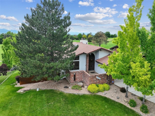 11621 Shoshone Way, Denver, CO 80234 - view of front of home with stucco siding and a front lawn