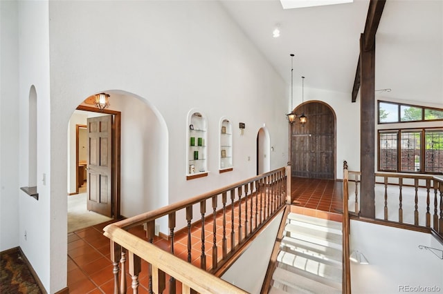 11621 Shoshone Way, Denver, CO 80234 - tiled foyer featuring high vaulted ceiling and arched walkways